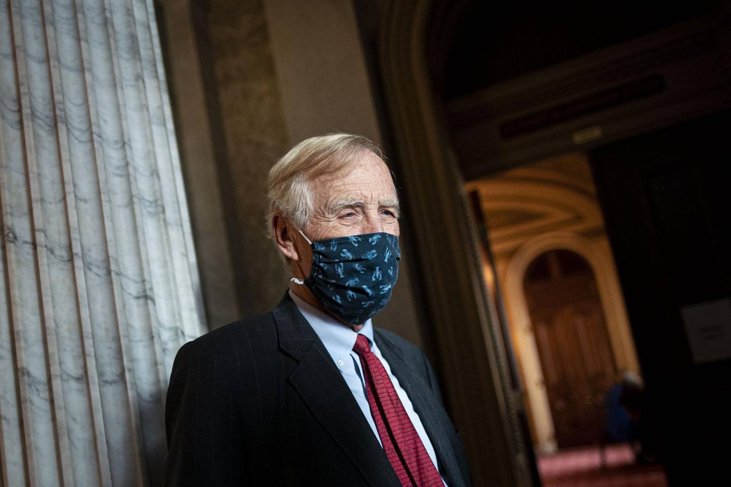 Senator Angus King, an Independent from Maine, wears a protective mask as he speaks to a member of the media at the U.S. Capitol in Washington, D.C., U.S., on Wednesday, Dec. 9, 2020. Treasury Secretary Mnuchin made a surprise re-entry into talks on a 2020 pandemic-relief package with a $916 billion proposal that opened a potential new path to a year-end deal despite objections from Democrats over elements of the plan. Photographer: Al Drago/Bloomberg