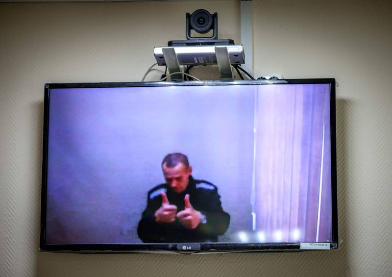 Jailed Kremlin critic Alexei Navalny appears on screen via video link from prison during a court hearing in Russia. AFP