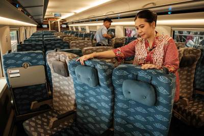 Staff change the direction of seats on the Jakarta-Bandung high-speed train for the return trip. AFP