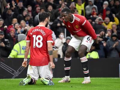 Manchester United's Bruno Fernandes celebrates with Paul Pogba after scoring his side's second goal against Brighton at Old Trafford in February, 2022, Reuters