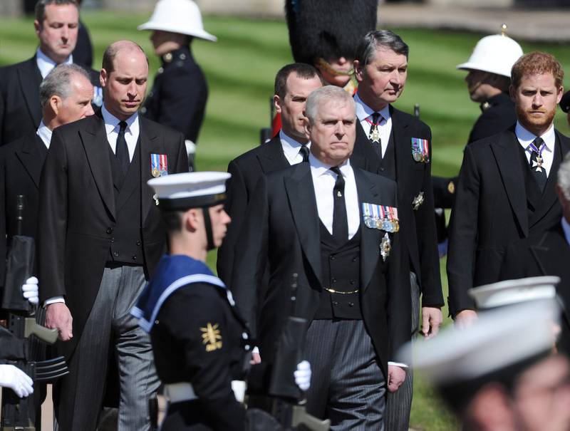 WINDSOR, ENGLAND - APRIL 17:  Prince Andrew, Duke of York; Prince Harry, Duke of Sussex; Prince William, Duke of Cambridge and Vice-Admiral Sir Timothy Laurence walk behind The Duke of Edinburghâ€™s coffin, covered with His Royal Highnessâ€™s Personal Standard, during the Ceremonial Procession during the funeral of Prince Philip, Duke of Edinburgh at Windsor Castle on April 17, 2021 in Windsor, England. Prince Philip of Greece and Denmark was born 10 June 1921, in Greece. He served in the British Royal Navy and fought in WWII. He married the then Princess Elizabeth on 20 November 1947 and was created Duke of Edinburgh, Earl of Merioneth, and Baron Greenwich by King VI. He served as Prince Consort to Queen Elizabeth II until his death on April 9 2021, months short of his 100th birthday. His funeral takes place today at Windsor Castle with only 30 guests invited due to Coronavirus pandemic restrictions. (Photo by Mark Large-WPA Pool/Getty Images)