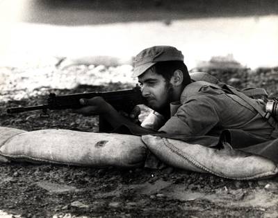 Sheikh Mohamed trains with a rifle at a military camp in Al Ain in the 1970s. Photo: National Archives