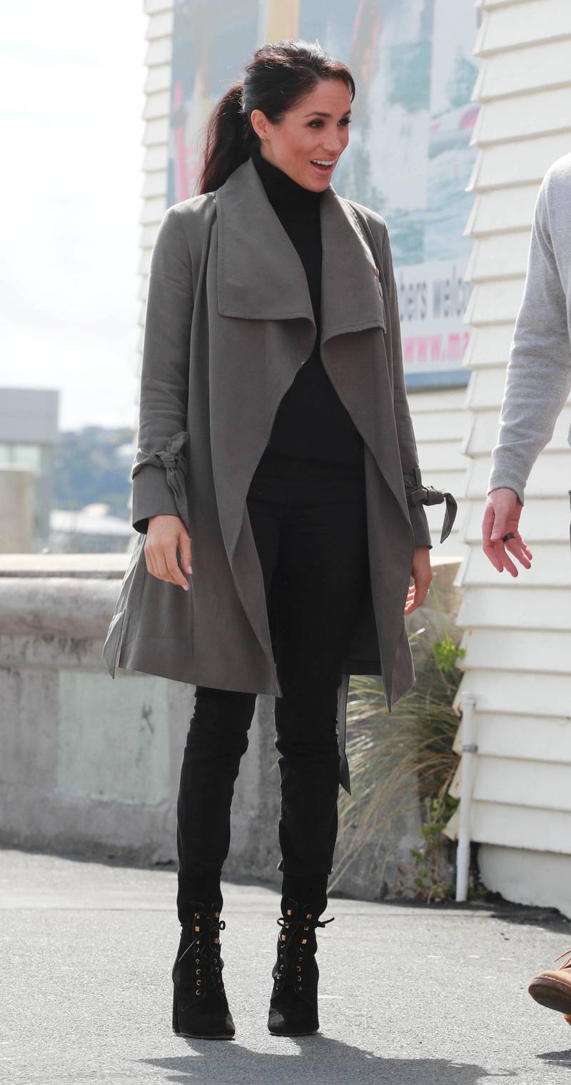 Meghan, Duchess of Sussex, wears a Club Monaco jacket, Outland Denim jeans and Stuart Weitzman boots outside the Maranui Cafe in Wellington, New Zealand on October 29, 2018. Reuters