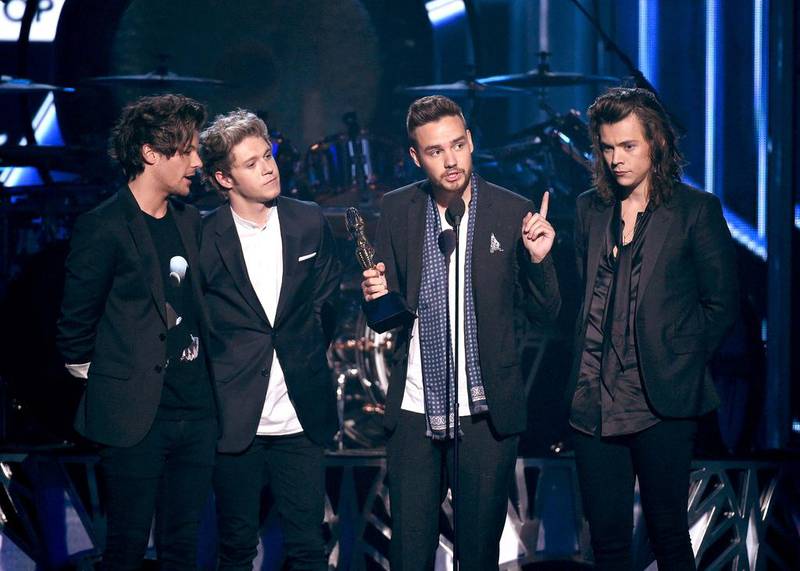 Recording artists Louis Tomlinson, Niall Horan, Liam Payne and Harry Styles of One Direction accept the Top Duo/Group award onstage. Ethan Miller / Getty Images / AFP
