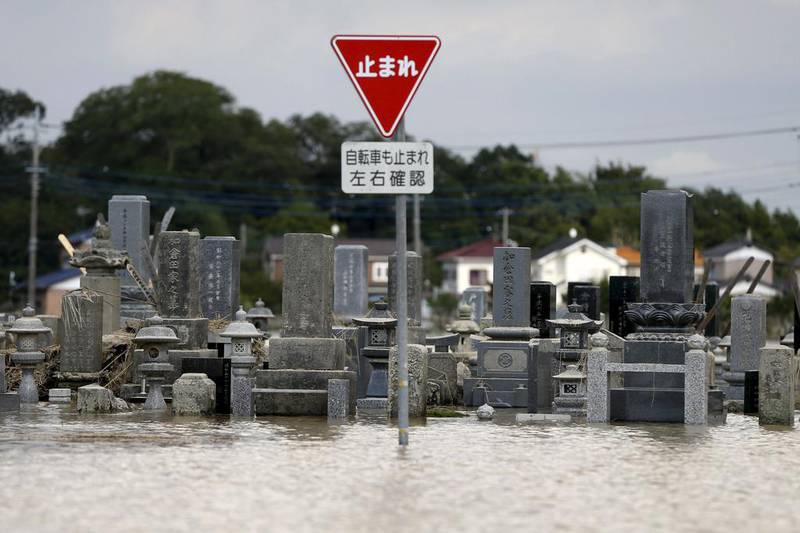 Floodwaters swamp a Japanese graveyard after the Kinugawa river broke its banks. Issei Kato / Reuters