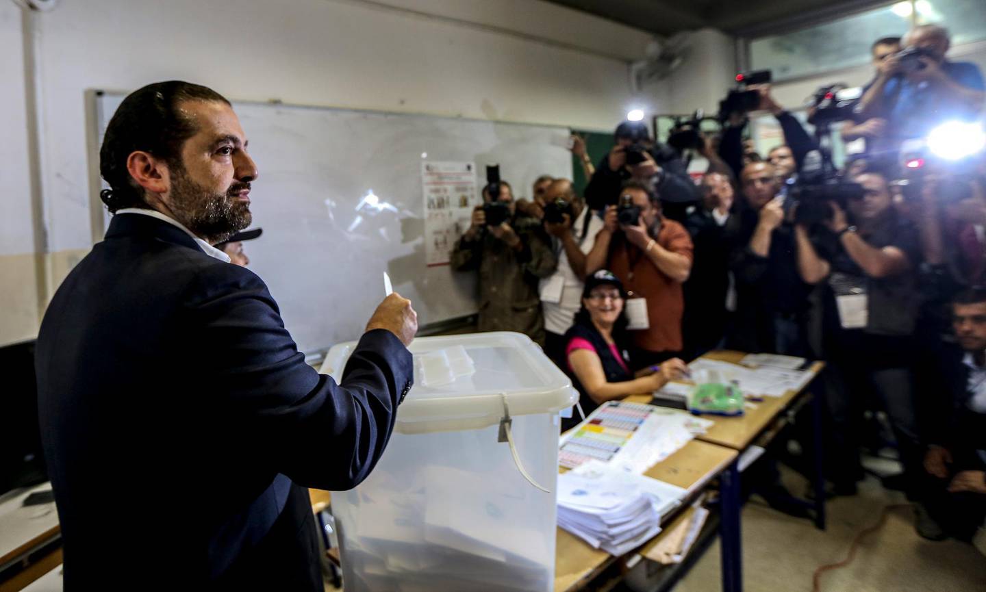 epa06715540 Lebanese Prime minister Saad Hariri casts his ballot at a ballot station in Baabda, south east Beirut, Lebanon, 06 May 2018. There are 976 candidates, including 111 women, competing for 128 seats in parliament divided equally between the Muslim and Christian sects,  during the general parliamentary elections after nine years of forced extension, through a new electoral law that adopts the percentage.  EPA/NABIL MOUNZER