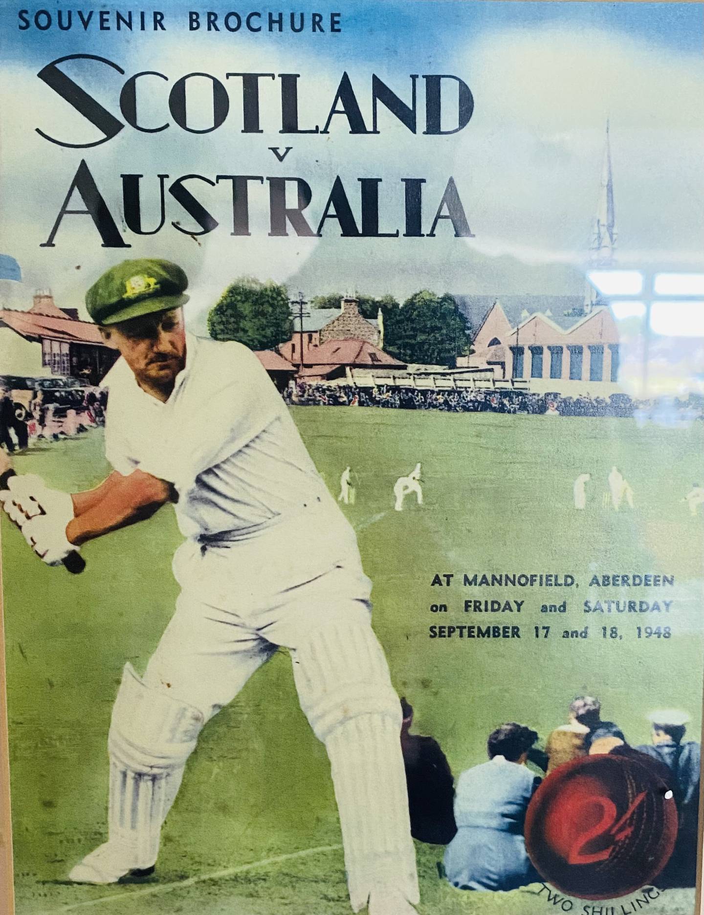 A front cover of the souvenir brochure of the visit of the 1948 Australians hangs in the Bradman Suite at Aberdeenshire Cricket Club.
