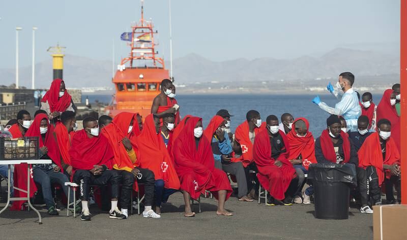 Migrants at the Port of Arrecife, Lanzarote, the Canary Islands, after being rescued at sea by Spanish coastguard. EPA