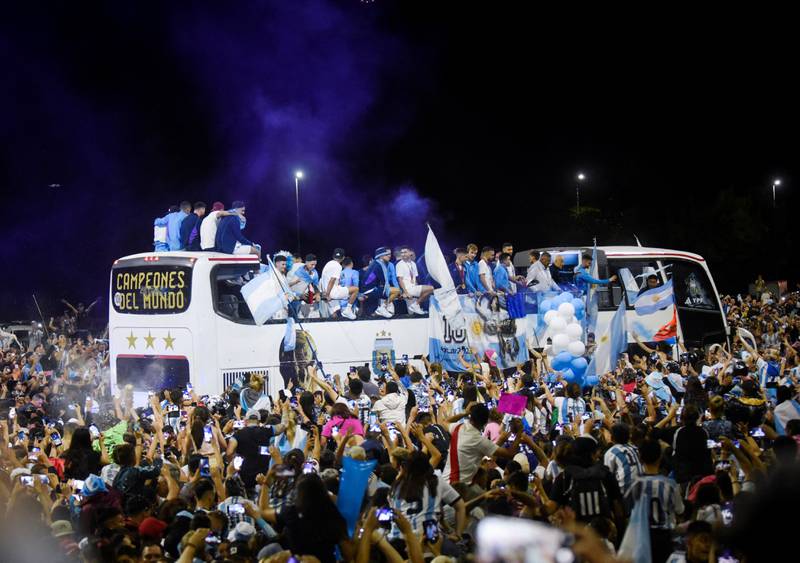 Fans gather outside the Argentinian Football Assocation headquarters as the Argentina team bus arrives. Reuters