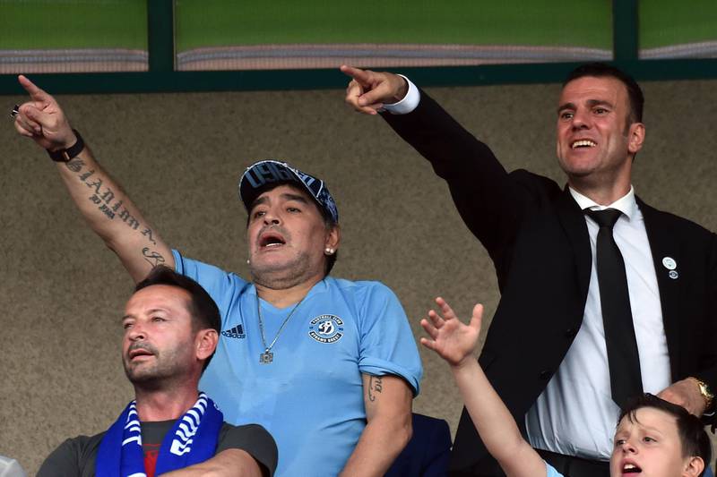 Diego Maradona watches a game from the stands. AFP