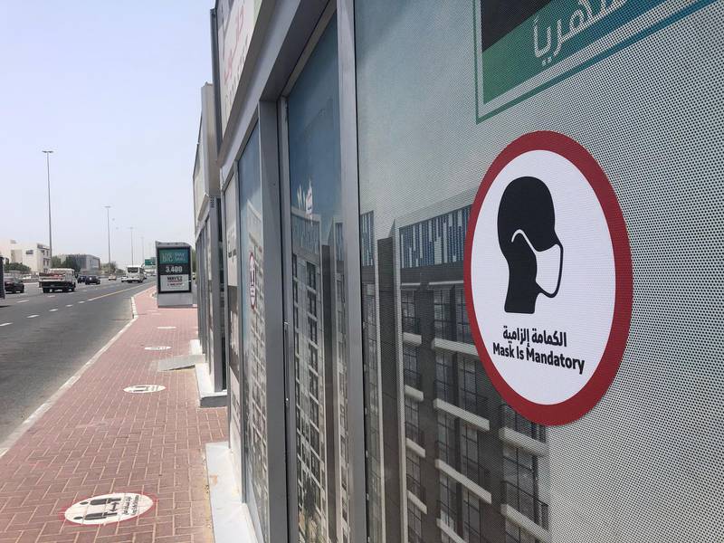 Dubai, United Arab Emirates - Reporter: N/A. Business. General view of a mask is mandatory sign at a bus station. Tuesday, July 21st, 2020. Dubai. Chris Whiteoak / The National