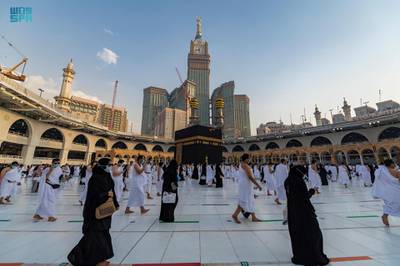 Pilgrims perform Umrah in compliance with Covid-19 social-distancing norms at the Grand Mosque in Makkah, Saudi Arabia. SPA