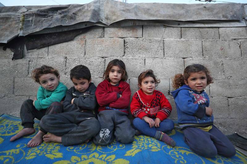 Children at a displacement camp near the village of Qah, in Syria's north-western Idlib province. AFP