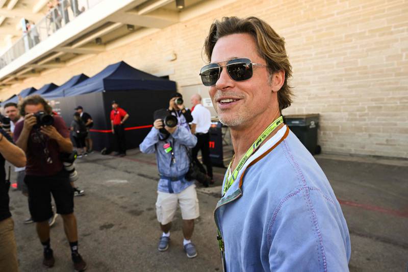 US actor Brad Pitt tours the paddock before the Formula One United States Grand Prix practice session at the Circuit of the Americas in Austin, Texas, on October 21, 2022.  (Photo by Patrick T.  FALLON  /  AFP)