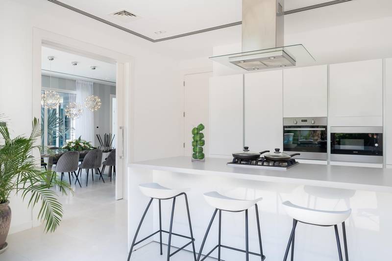 The modern kitchen opens into the dining room. Courtesy Allsopp and Allsopp