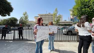 An image that illustrates this article Three women protest against Jordan's new child law 