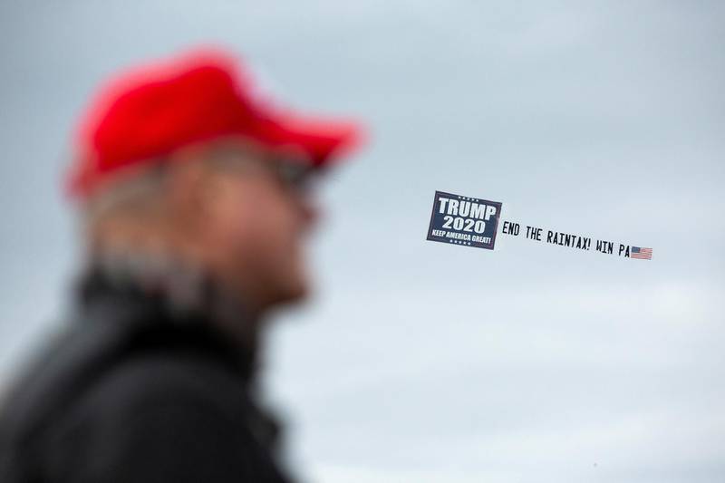 A banner is seen in the sky as supporters of US President Donald Trump gather for a Bikers for Trump event in Wilkes-Barre, Pennsylvania, US. Reuters