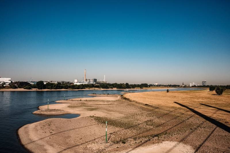A large section of exposed River Rhine riverbed, due to low water levels caused by drought, in Duesseldorf, Germany. Bloomberg