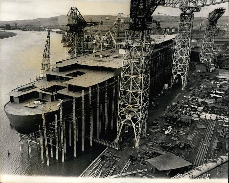 E0XKN9 Mar. 03, 1967 - The Q 4 Takes Shape: New view of the 58,000-ton liner Q.4., pictured yesterday at John Brown's shipyard, Clydebank, where she is now taking shape. the stern is almost finished and the - prefabricated decks are starting to go on top. The liner is to be launched by H.M. The Queen on September 30.