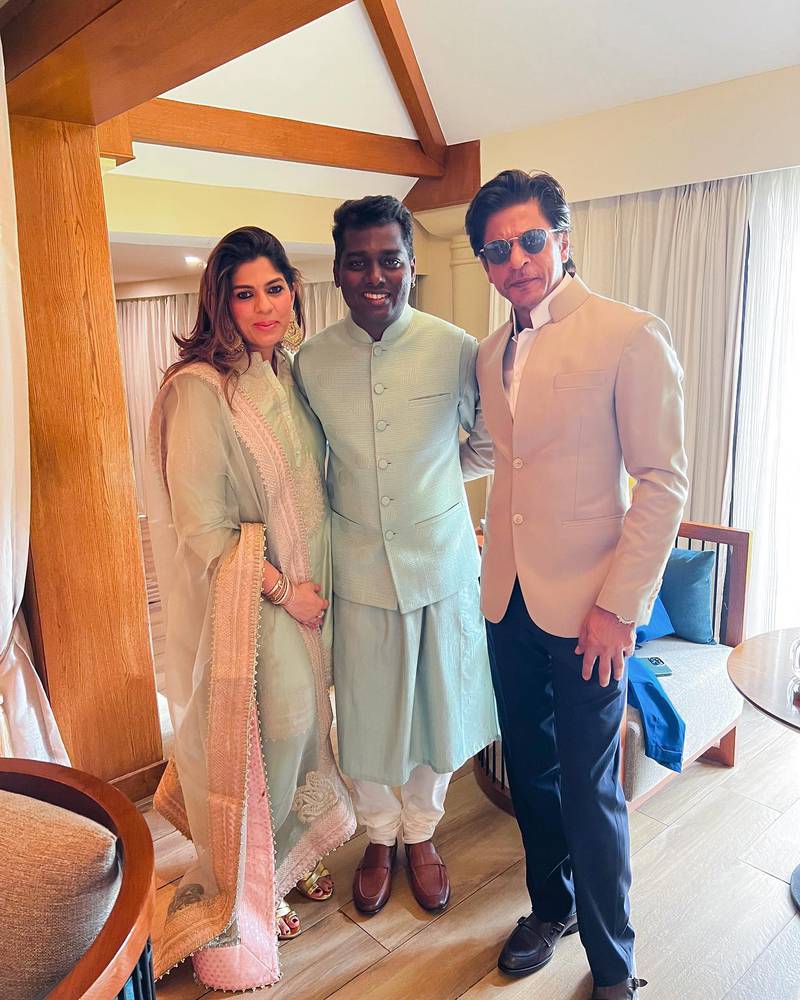 Bollywood superstar Shah Rukh Khan, right, with film director Atlee, centre, and Khan's manager Pooja Dadlani Gurnani, at the wedding. Photo: Instagram / atlee47