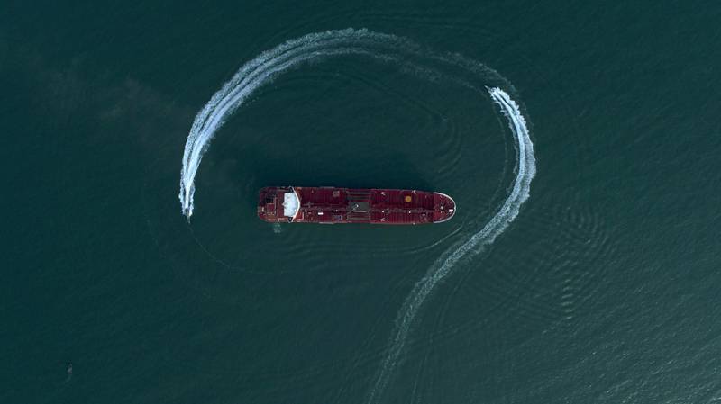 Speedboats from Iran's Revolutionary Guard circle the British-flagged oil tanker Stena Impero on Sunday, July 21, 2019 in the Iranian port of Bandar Abbas, after it was seized in the Strait of Hormuz two days earlier. Iran's president, Hassan Rouhani, suggested Wednesday that Stena Impero could be released if the U.K. takes similar steps to hand back an Iranian oil tanker seized by the Royal Navy off Gibraltar earlier this month. (Morteza Akhoondi/Tasnim News Agency via AP)