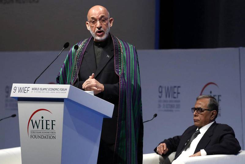 Afghanistan's president Hamid Karzai addresses the World Islamic Economic Forum, alongside Bangladeshi president Abdul Hamid. Luke MacGregor / Reuters
