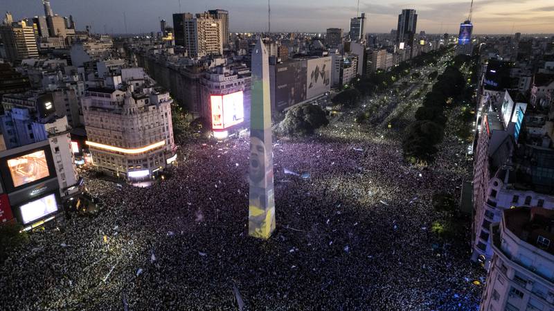 The face of Lionel Messi projected on to the obelisk in central Buenos Aires as fans celebrate Argentina's World Cup victory. AP