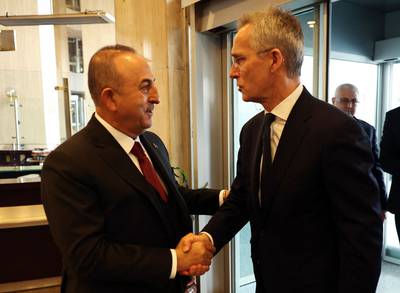 Turkish Foreign Minister Mevlut Cavusoglu, left, with Nato Secretary General Jens Stoltenberg in Ankara. AFP