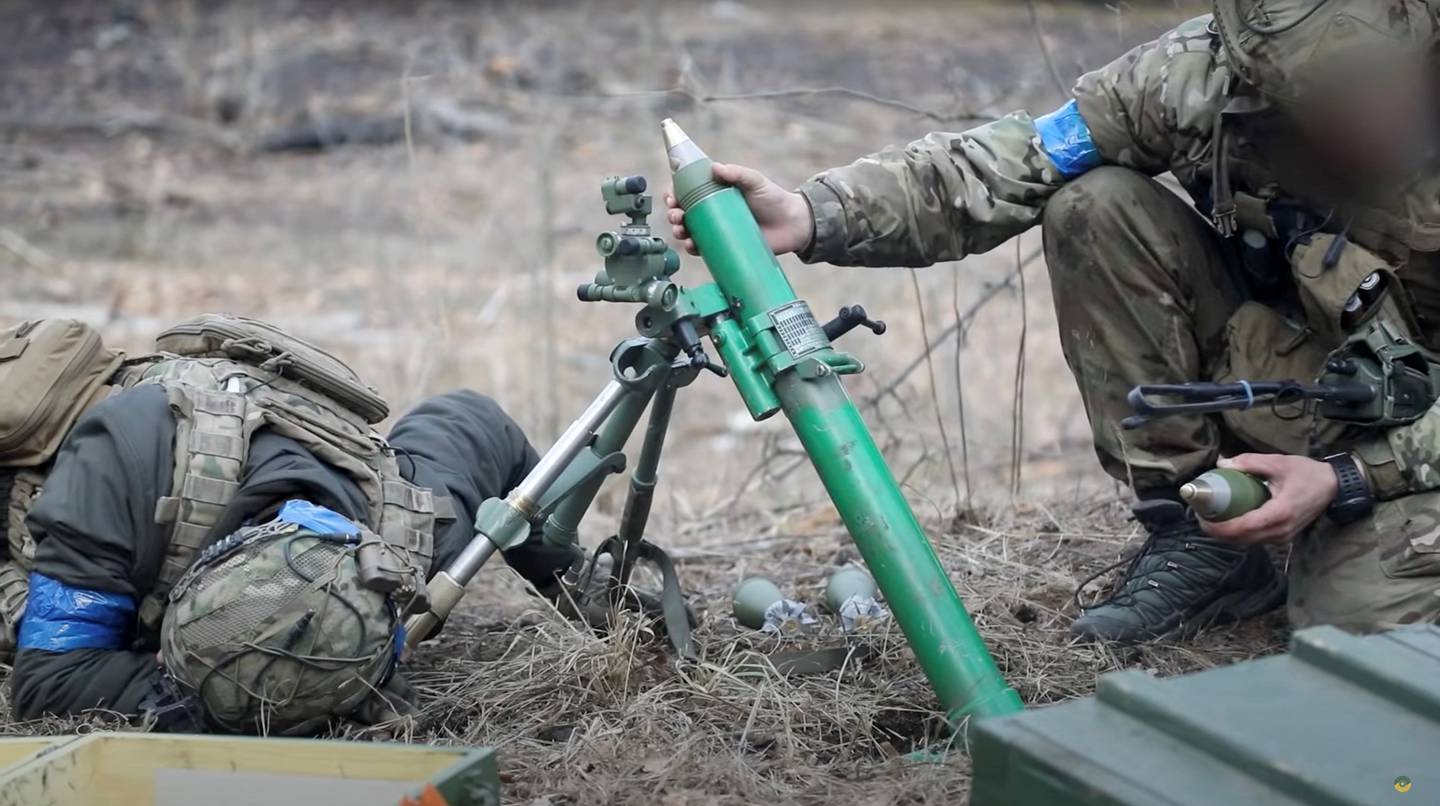 Ukrainian soldiers fire a mortar, in footage said to show combat with Russian troops near the Kyiv region, in Moshchun, Ukraine. Reuters