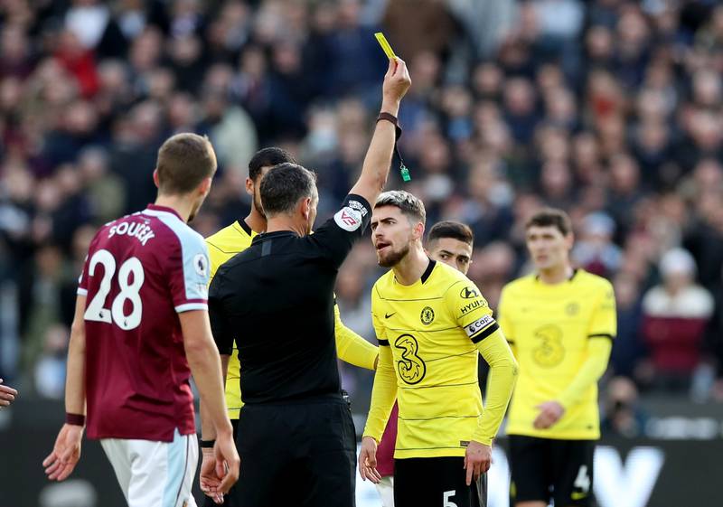 Chelsea's Jorginho is shown a yellow card by referee Andre Marriner. Reuters