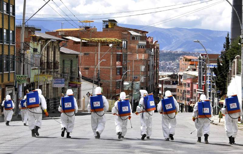 Municipal workers disinfect the streets of La Paz as a preventive measure to slow the spread of the novel coronavirus, COVID-19.  AFP