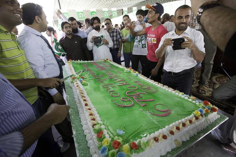 People photograph a specially made Independence Day cake.