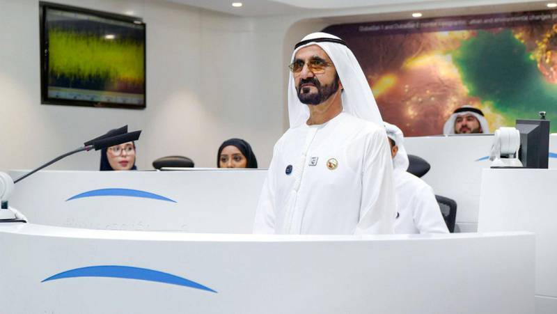 Sheikh Mohamed Bin Rashid talks with Emirati astronaut, Hazza Al Mansouri, during a live satellite feed from the International Space Station. Courtesy Dubai Media Office