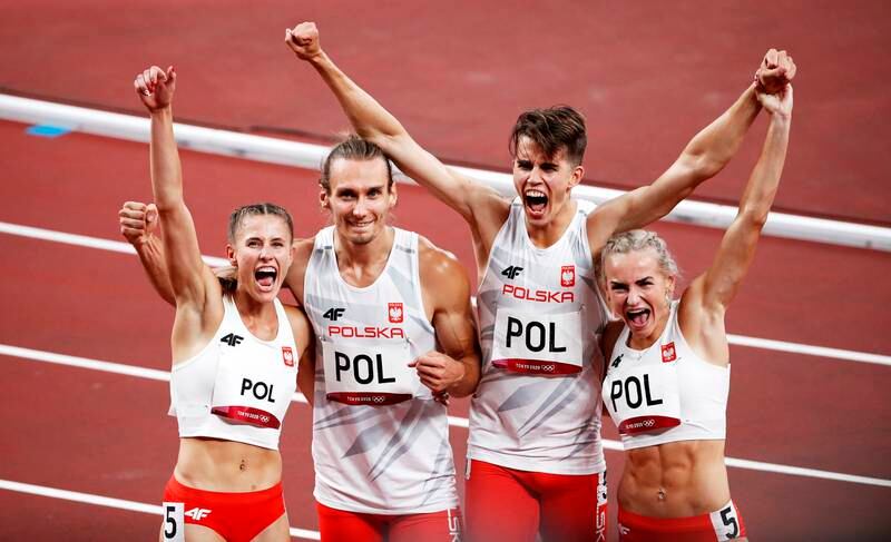 Poland's relay team celebrate awinning the 4x400m mixed relay.