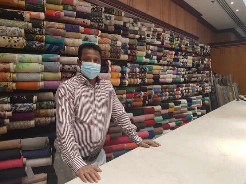 Mohammed Hossain, manager of textile shop Signi Trading at Al Ghurair Centre. Saeed Saeed / The National