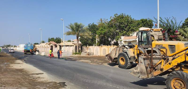 Diggers are used to clear debris from streets on Wednesday