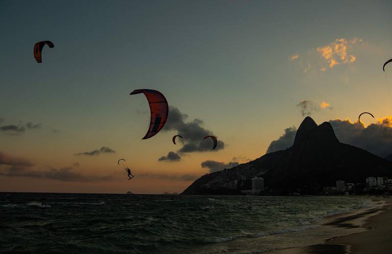 Kitesurfers soar above Ipanema Beach in Rio de Janeiro, Brazil. AFP