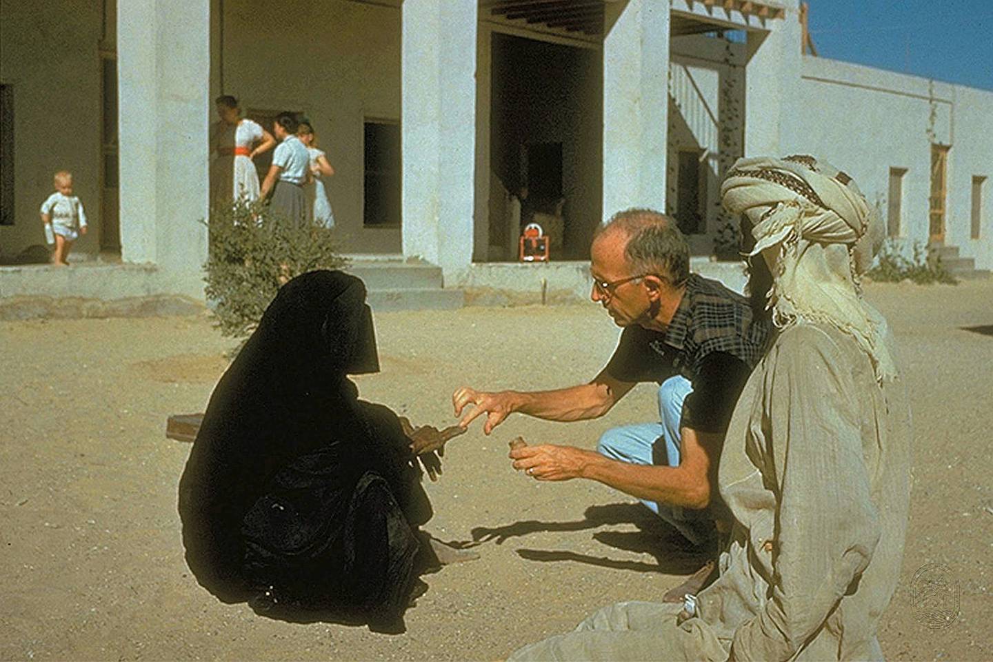 Dr Pat Kennedy treating a woman at the original hospital compound, circa 1961. This handout photograph is an archival image of the Oasis hospital Al Ain in the 1960s. Courtesy of Brooks Glett/Oasis Hospital