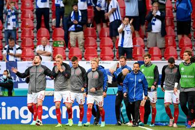 Denmark players return to resume the match against Finland two hours after midfielder Christian Eriksen collapsed in Copenhagen on Saturday, June 12. AP