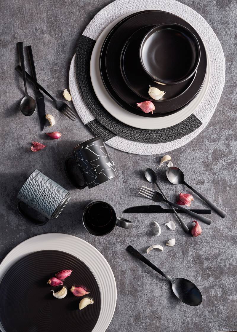 This monochrome 12-piece dinner set from Home Centre is for Dh179. Photo: Home Centre