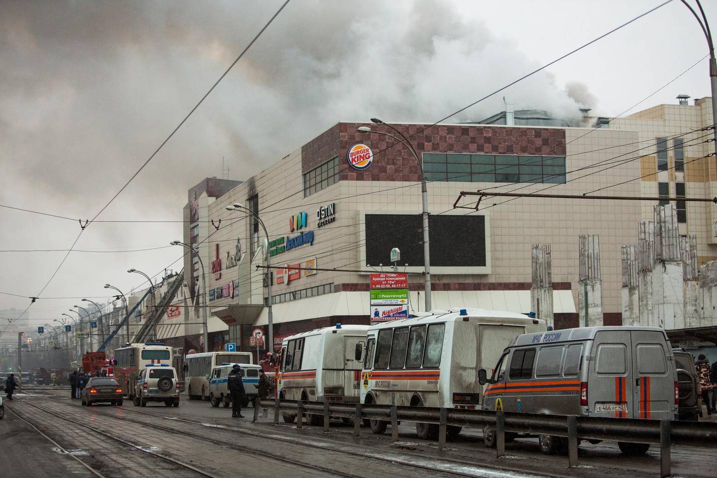 Smoke rises above a multi-story shopping center in the Siberian city of Kemerovo, about 3,000 kilometers (1,900 miles) east of Moscow, Russia, on Sunday, March 25, 2018. At least three children and a woman have died in a fire that broke out in a multi-story shopping center in the Siberian city of Kemerovo. (AP Photo/Sergei Gavrilenko)