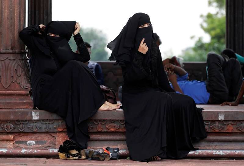 Indian Muslim women rest inside Jama Masjid in New Delhi, India, Tuesday, Aug. 22, 2017.  India's Supreme Court on Tuesday struck down the triple talaq Muslim practice that allows men to instantly divorce their wives as unconstitutional. (AP Photo/Tsering Topgyal)