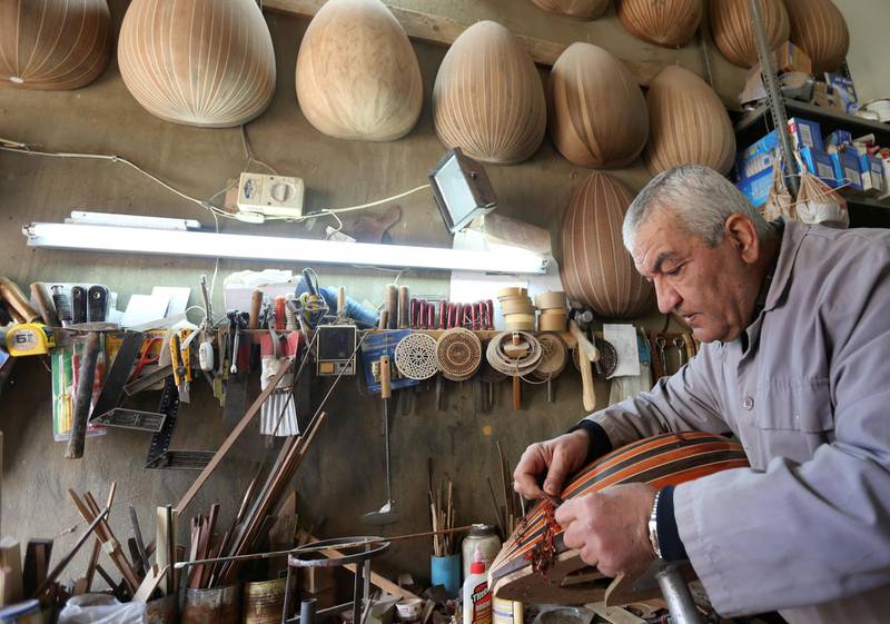 Lebanese oud maker and player Nazih Ghadban works on an oud body at his workshop in Ras Baalbek, Lebanon. Reuters