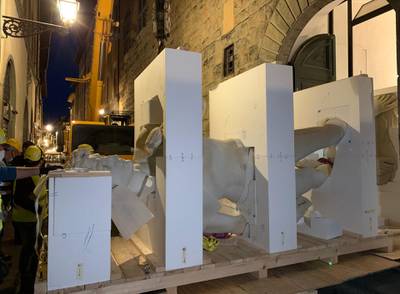 A team checks a model of Michelangelo’s famous David sculpture in the narrow streets of Florence before loading it on to a truck to be transported via cargo plane to the Dubai Expo. Courtesy: OTIM