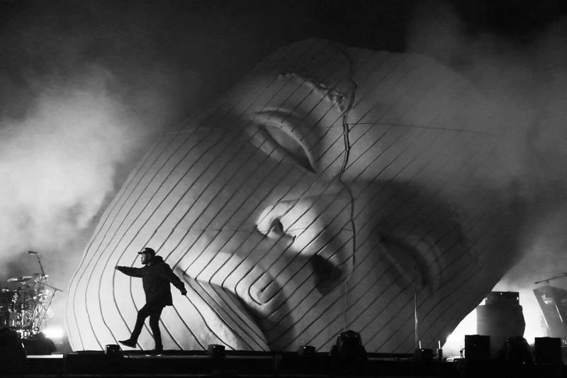 The Weeknd performs at Coachella on one of Devlin's sets. Featuring a large-scale mask, the work explored the use of portraiture and alter egos in performance