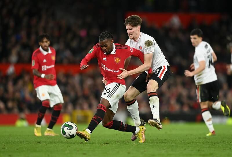 Anthony Elanga of Manchester United battles for possession with Lucas Ness. Getty