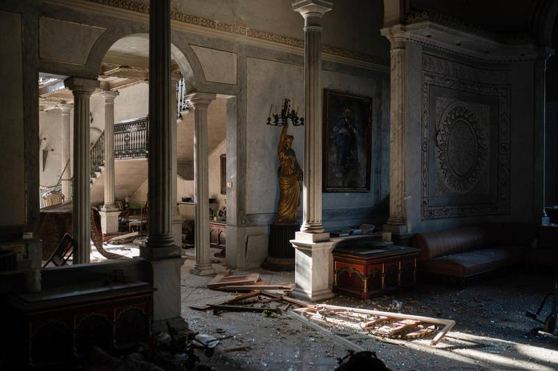 Broken glass and window frames lay on the floor of the Sursock Palace.  AP Photo