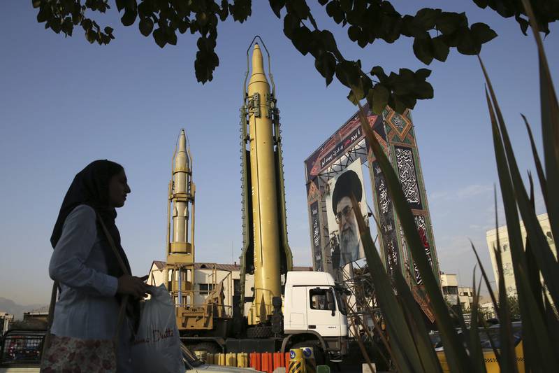 Missiles are displayed alongside a portrait of Iran's supreme leader Ayatollah Ali Khamenei in Tehran. AP 