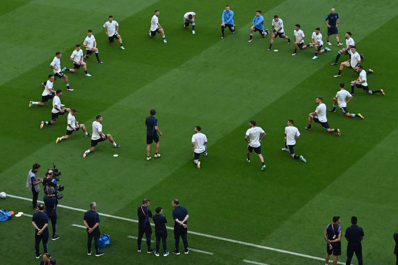 Argentina's players warm up ahead of the match against Saudi Arabia. AFP