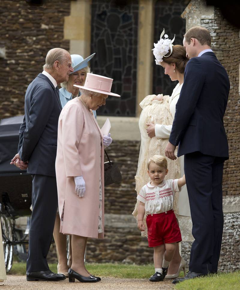 Queen Elizabeth II, in light pink, with members of the royal family, arrives at the Church of St Mary Magdalene on the Sandringham Estate for the Christening of Princess Charlotte of Cambridge on July 5, 2015, in King's Lynn, England. Getty Images
